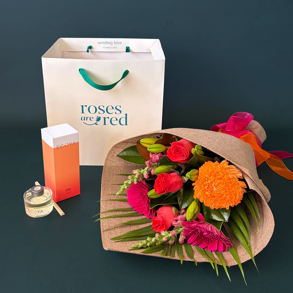Flowers & Ecoya Gift featuring a hot pink and orange flower posy with Ecoya Blood Orange fragrance products