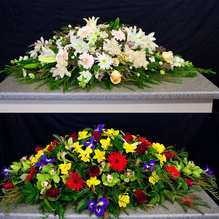 Double ended casket spray handcrafted with seasonal flowers for a funeral or memorial service